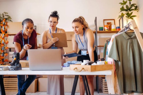 young woman using laptop in her small business - fashion stock pictures, royalty-free photos & images