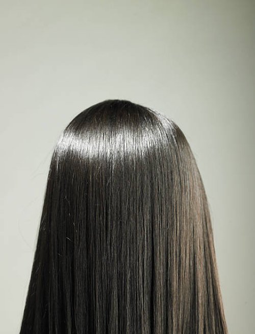 young woman with long hair, rear view - hairstyle stock pictures, royalty-free photos & images