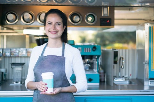 young woman working at a food truck - junk food stock pictures, royalty-free photos & images