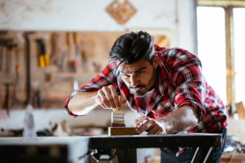 young worker in workshop - home decoration stock pictures, royalty-free photos & images