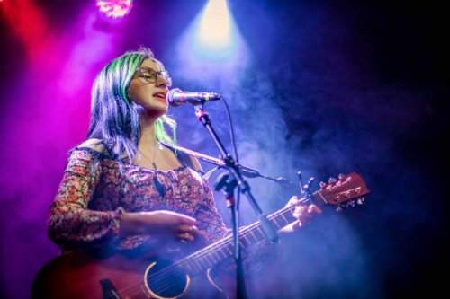 your woman singer and guitarist performing live concert - concert stock pictures, royalty-free photos & images