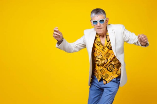youthful old man in the sixties having fun and dancing - fashion stock pictures, royalty-free photos & images
