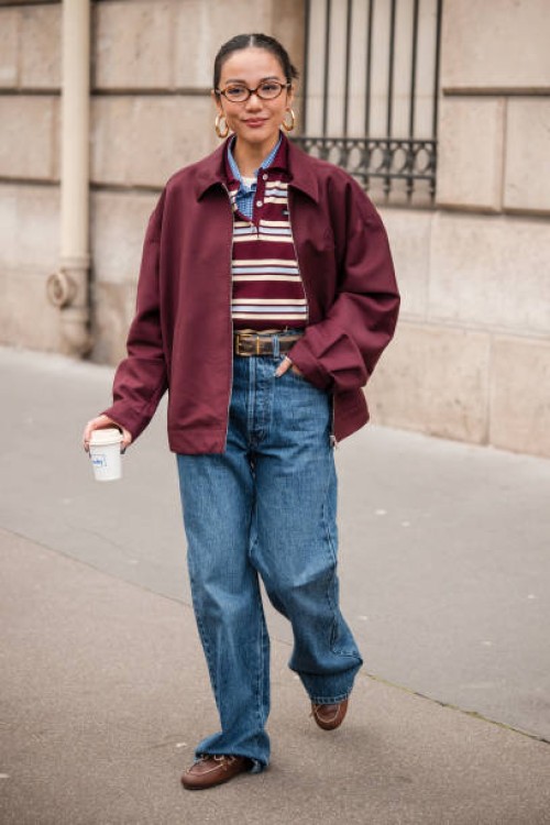 Yoyo Cao wears brown and white Miu Miu polo neck top, blue checked shirt, burgundy Miu Miu jacket, blue jeans, brown loafers, brown belt, outside Miu...